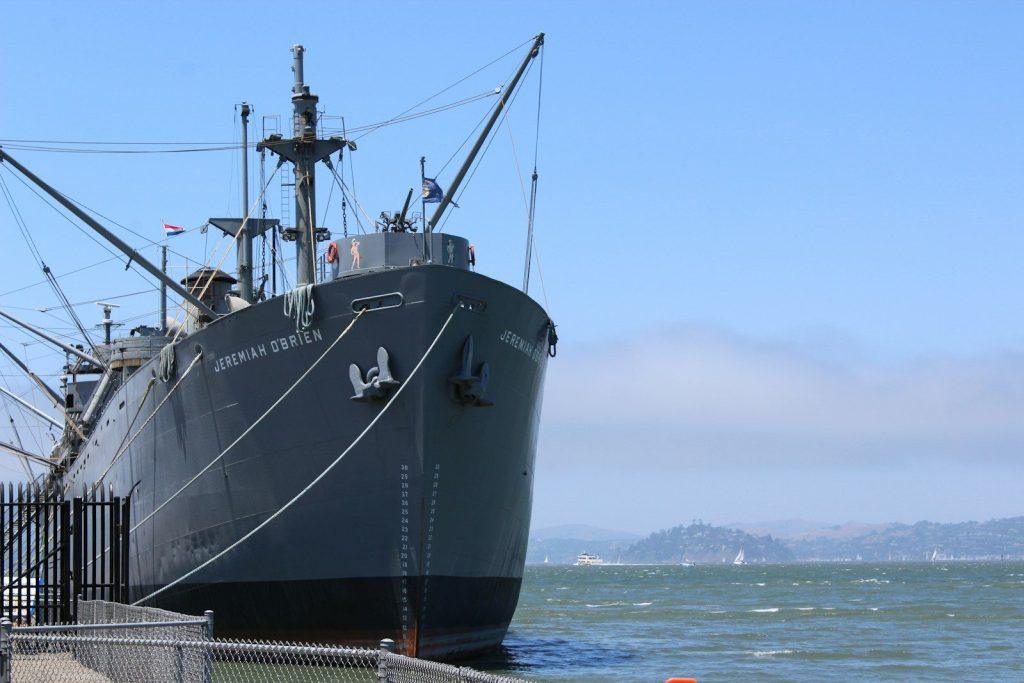 a large boat docked at a pier in the water